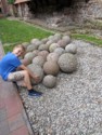 Nicholas tries to lift a stone cannon ball